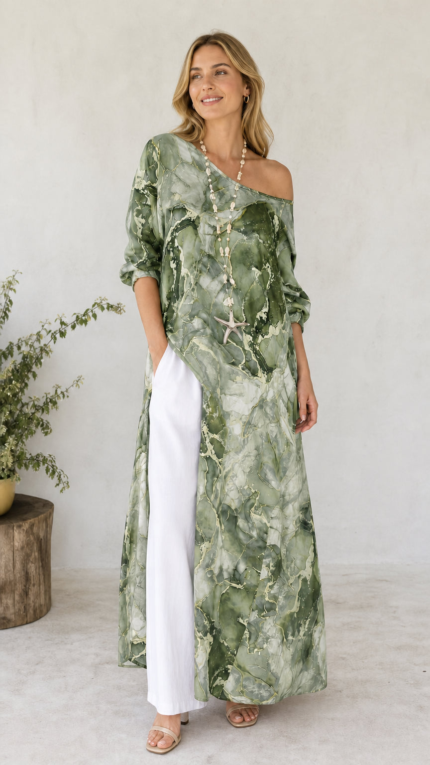 Model wearing green marble print off-shoulder maxi tunic with white pants