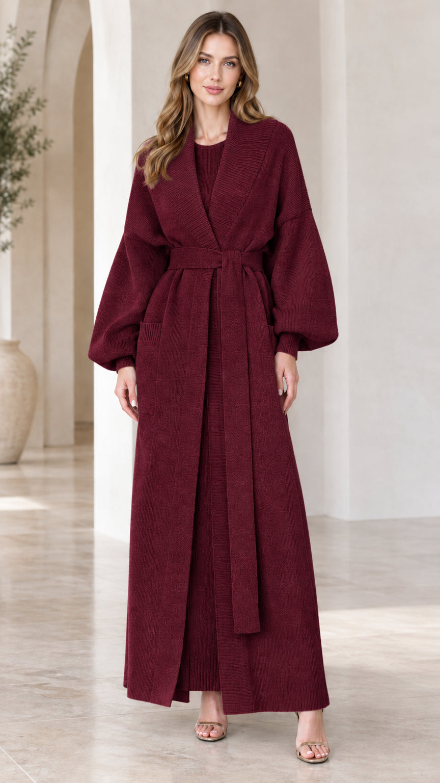 Full-length view of woman wearing burgundy wine red maxi belted knit cardigan set
