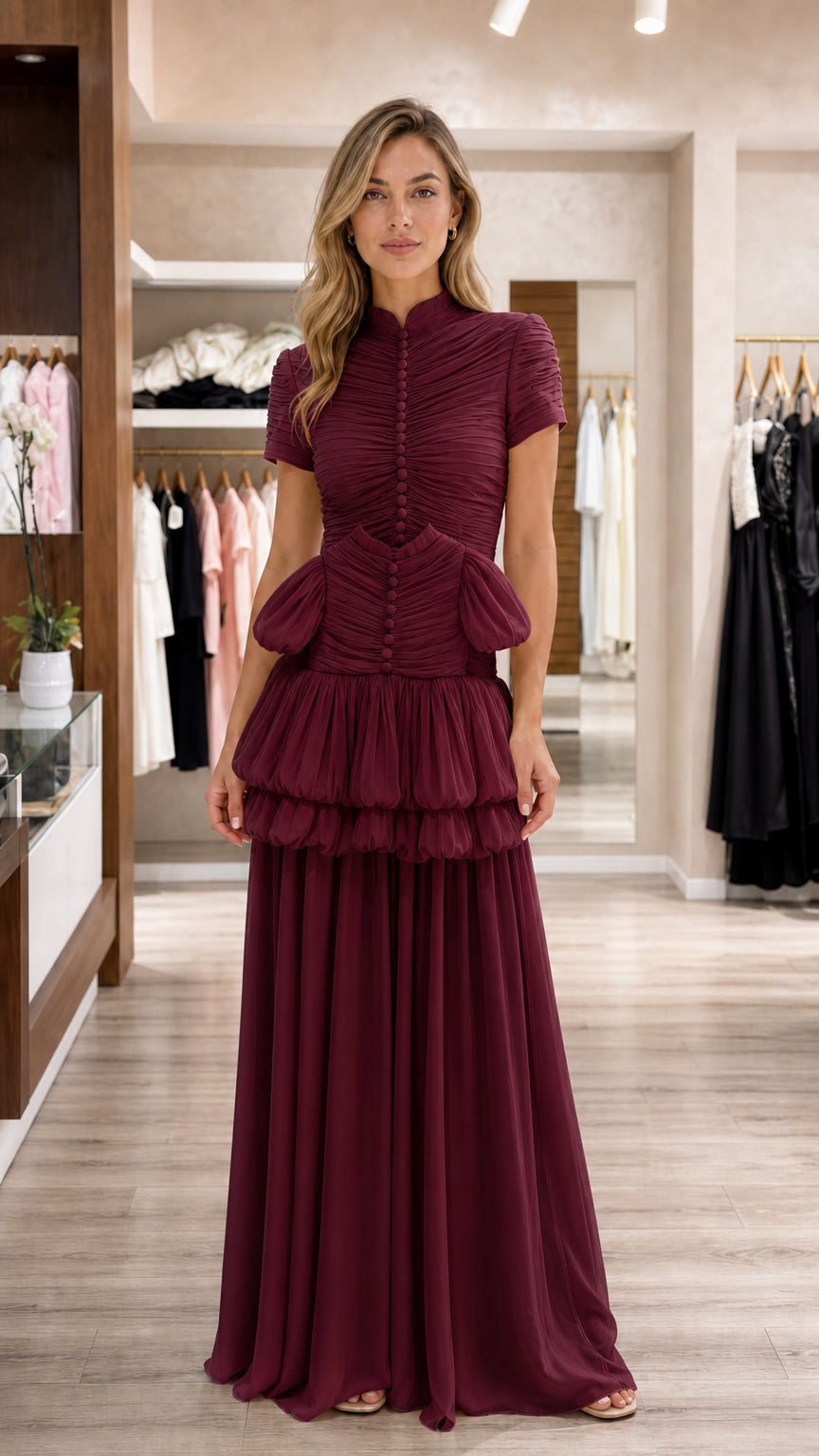 Model wearing burgundy wine tiered mock neck evening gown