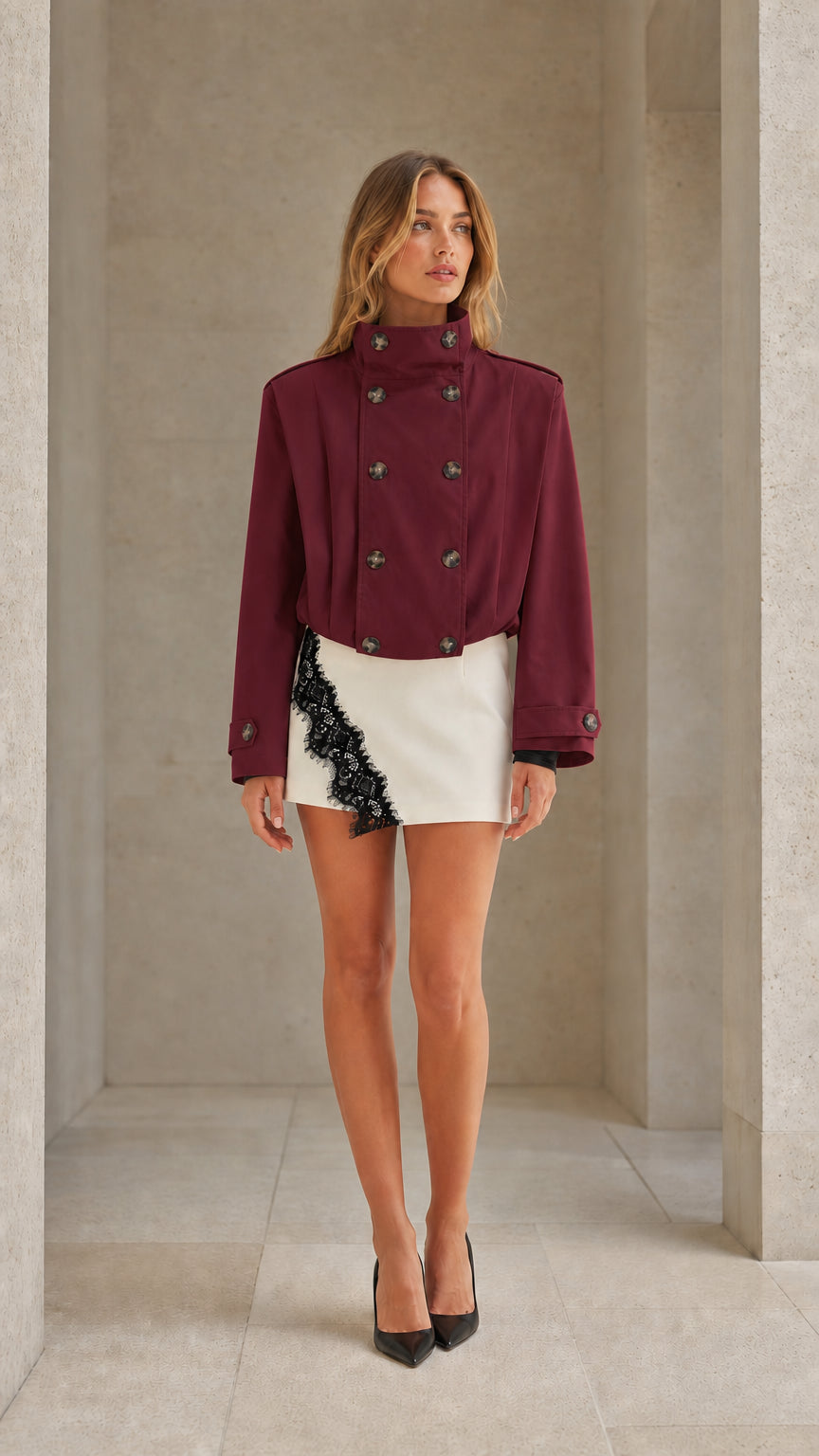 Front view of woman wearing burgundy wine cropped double-breasted trench jacket