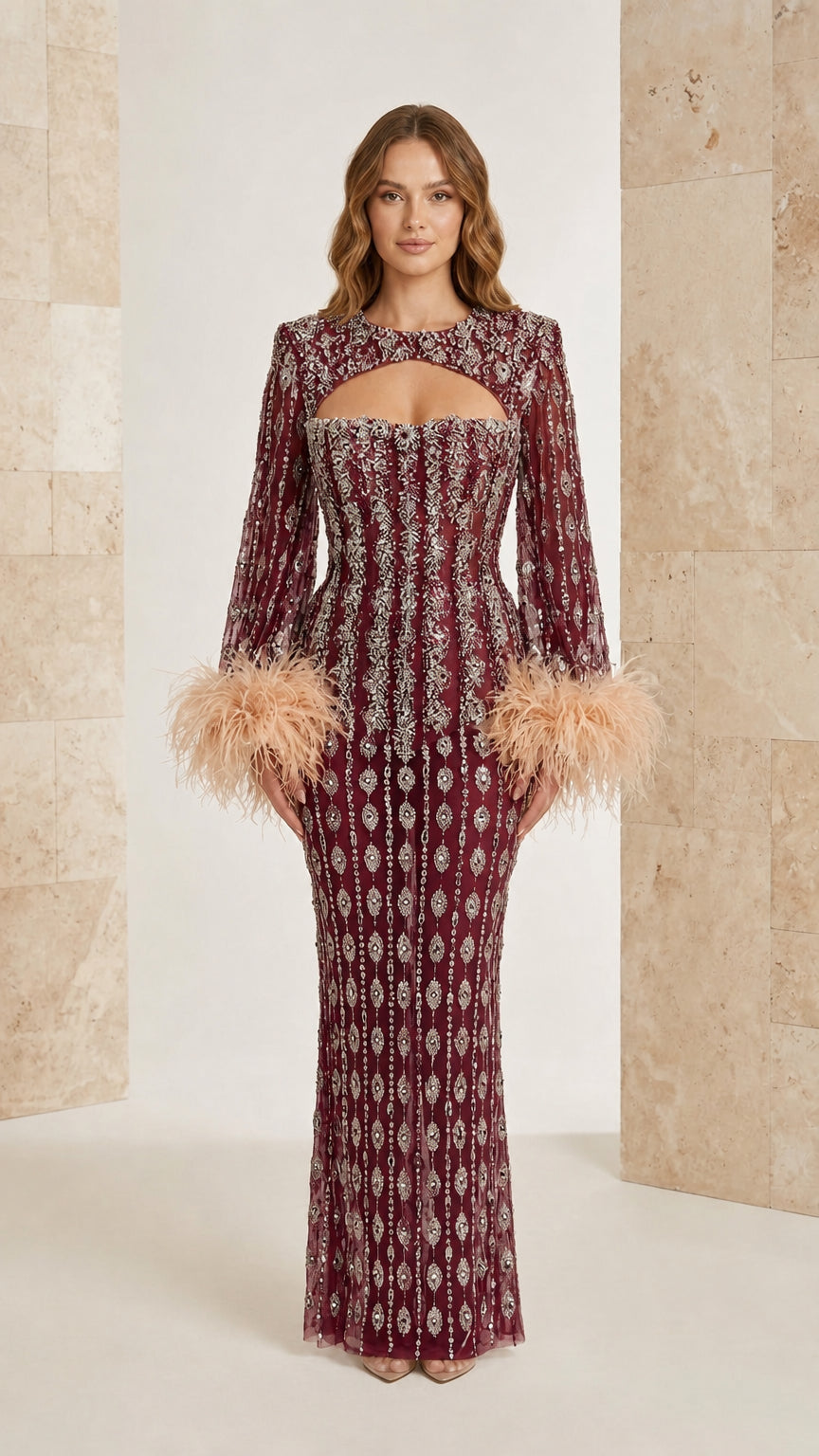 Burgundy beaded long sleeve evening dress with feather trim sleeves