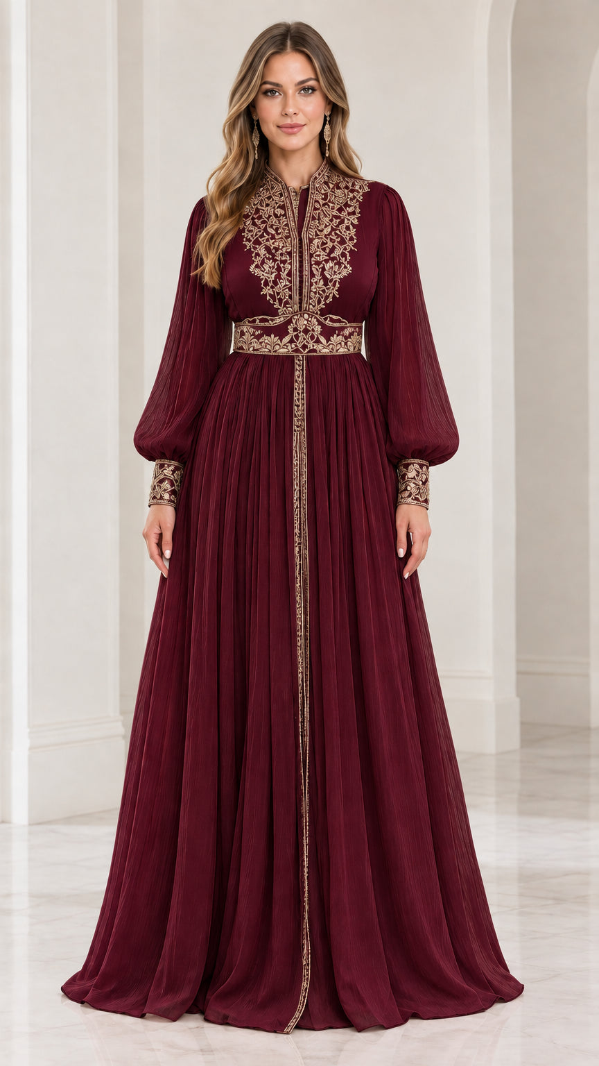 Front view of model wearing burgundy red embroidered long sleeve evening gown