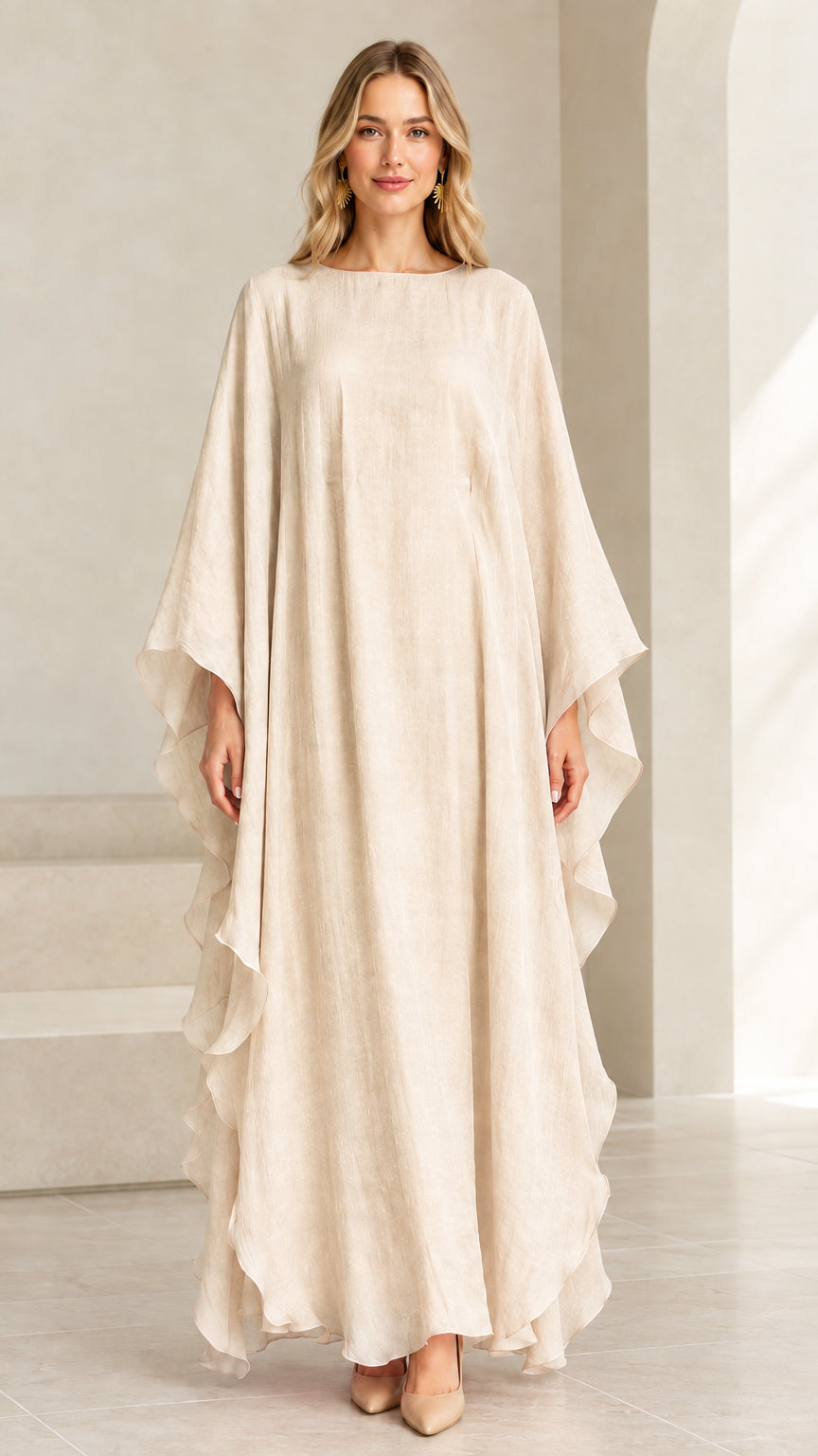 Model wearing champagne cream flowing kaftan maxi dress