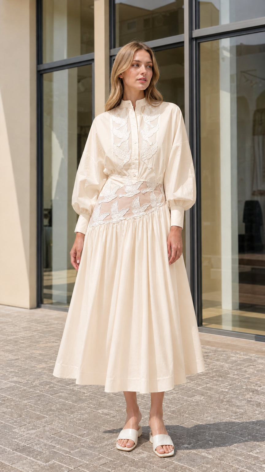 Model wearing cream off-white embroidered lantern sleeve midi shirt dress
