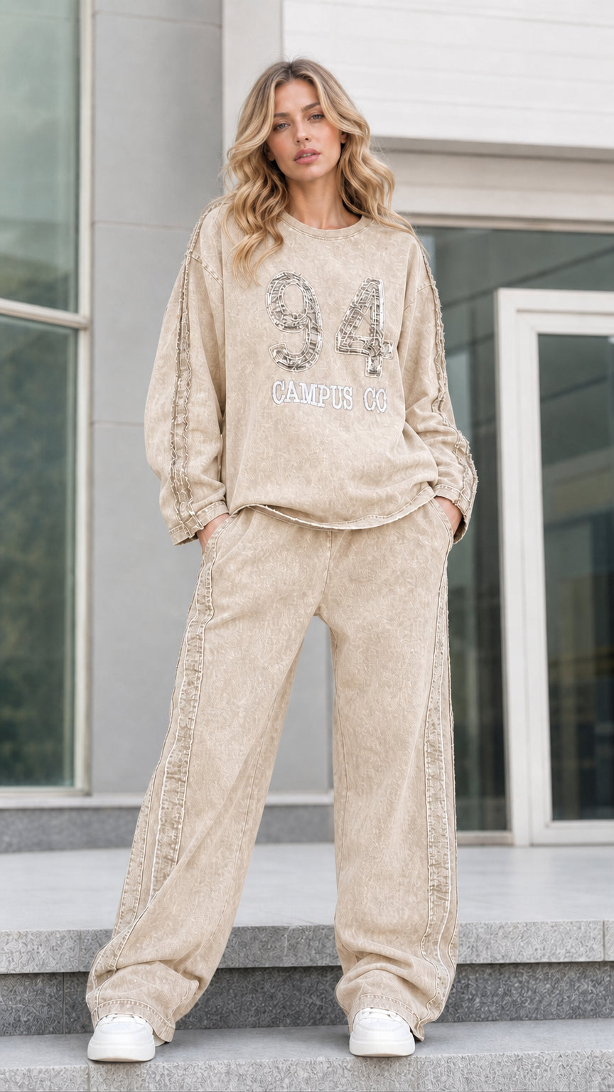 Full-length front view of beige sand washed graphic sweatshirt and wide leg lounge set