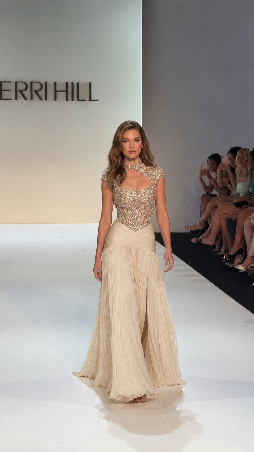 Model wearing Champagne gold crystal-adorned pleated formal gown