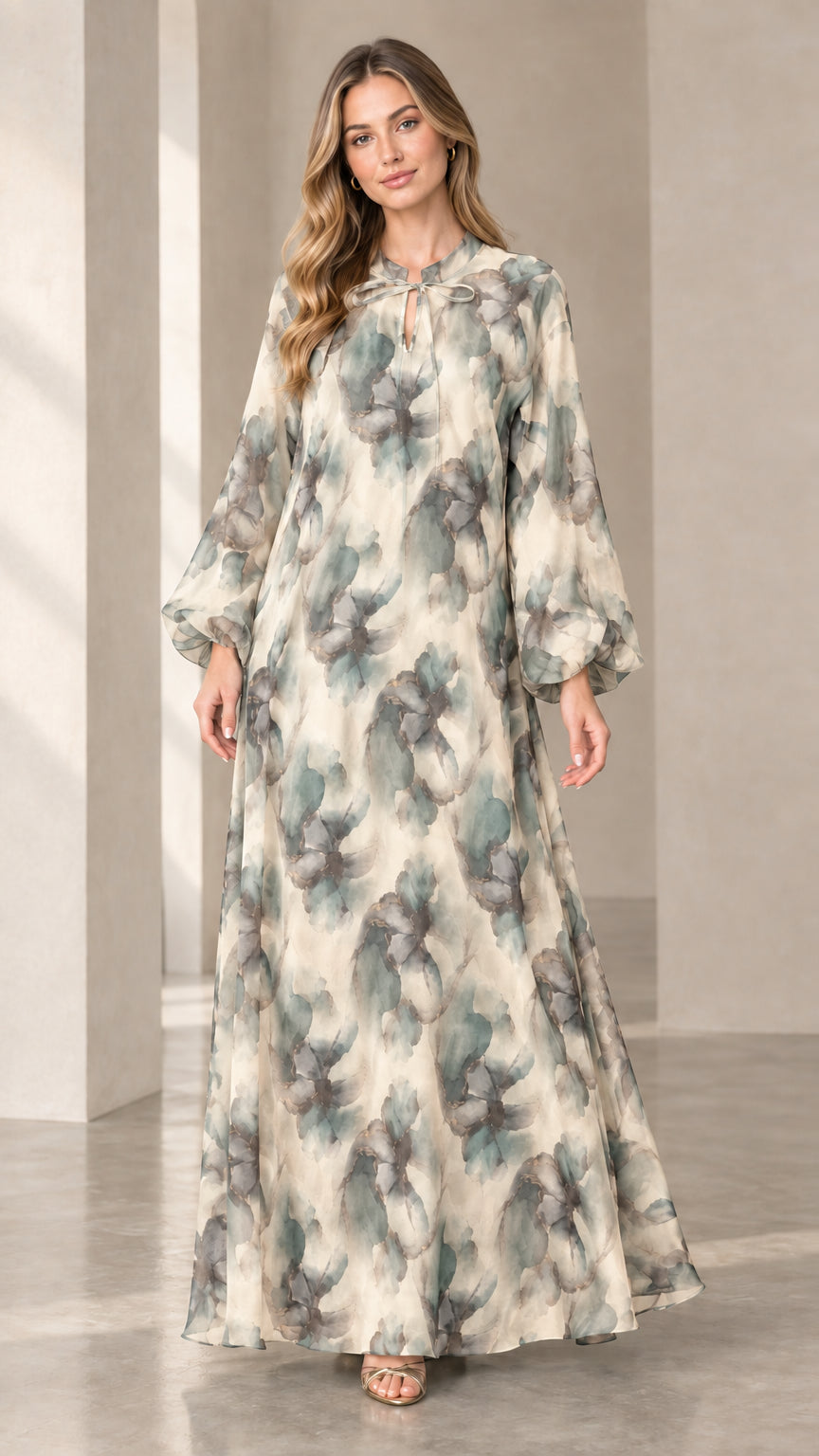 Front view of woman wearing cream and sage floral chiffon maxi dress