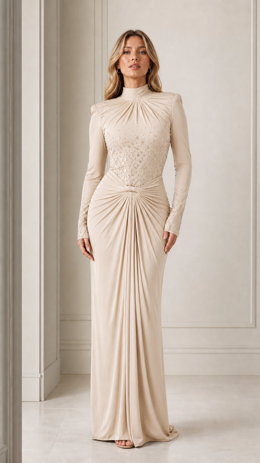 Model wearing the long-sleeve mock neck draped maxi evening gown in champagne