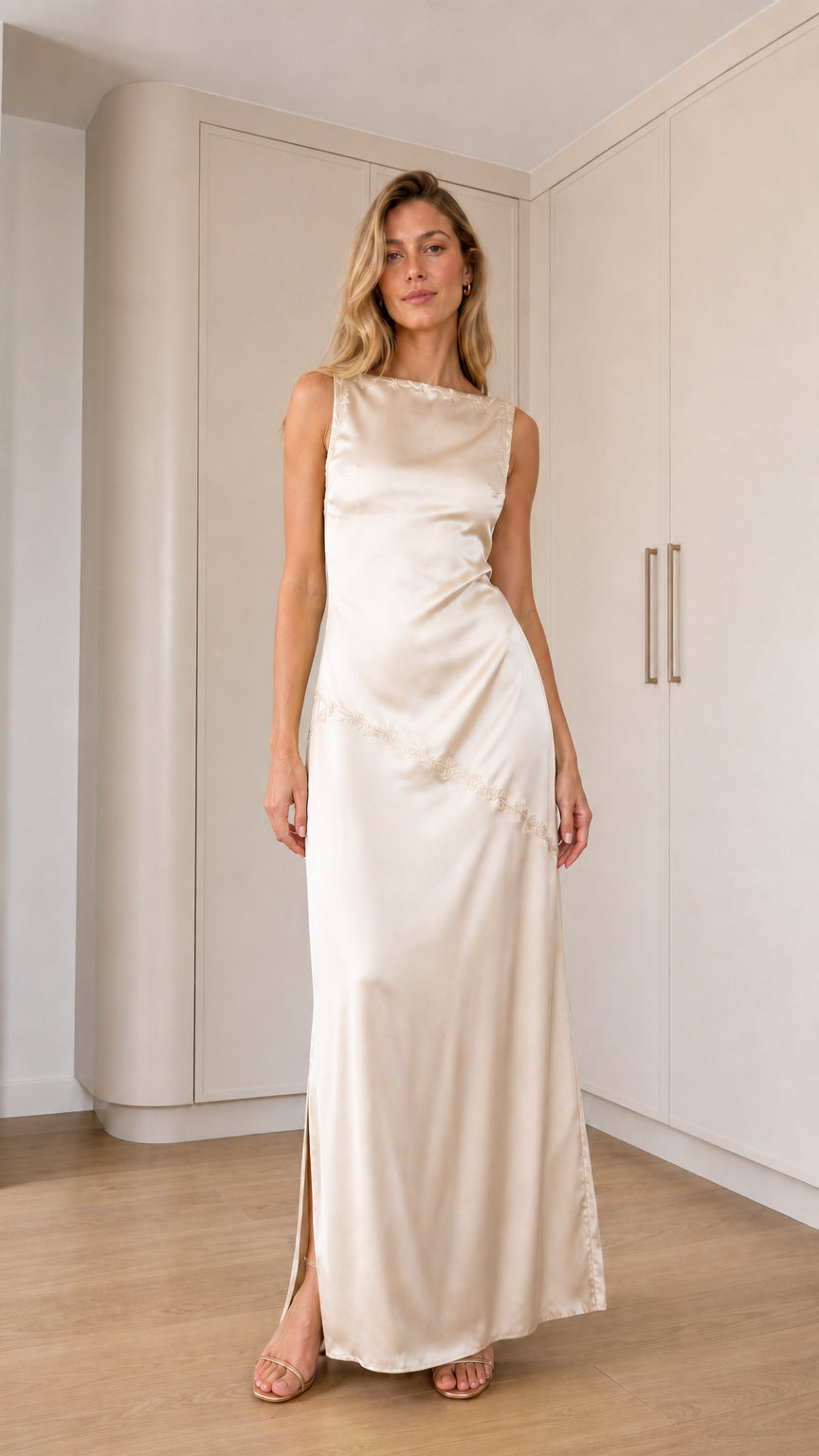 Front full-length view of model wearing champagne sleeveless satin maxi dress