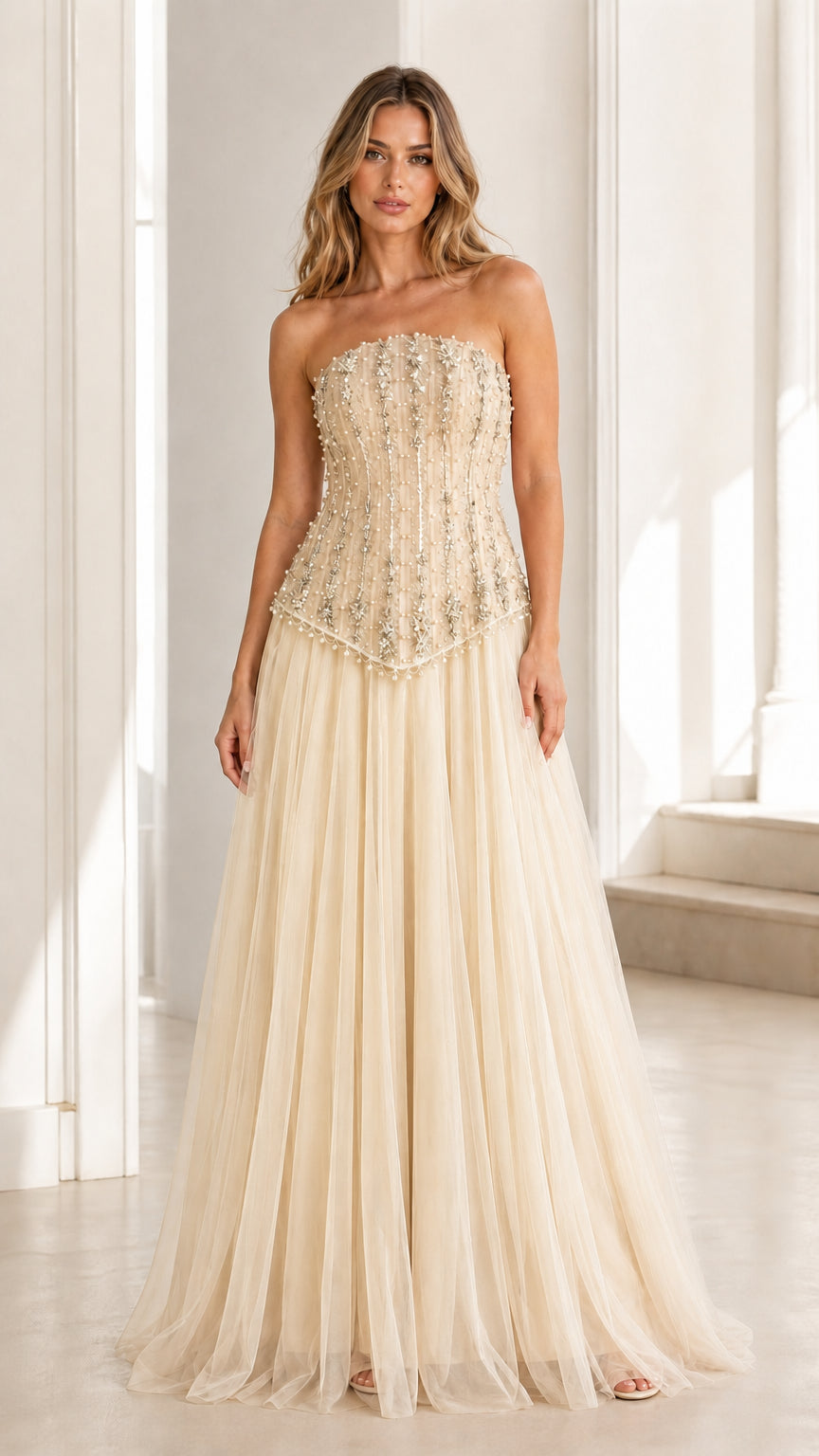 Front view of champagne embellished strapless tulle evening gown