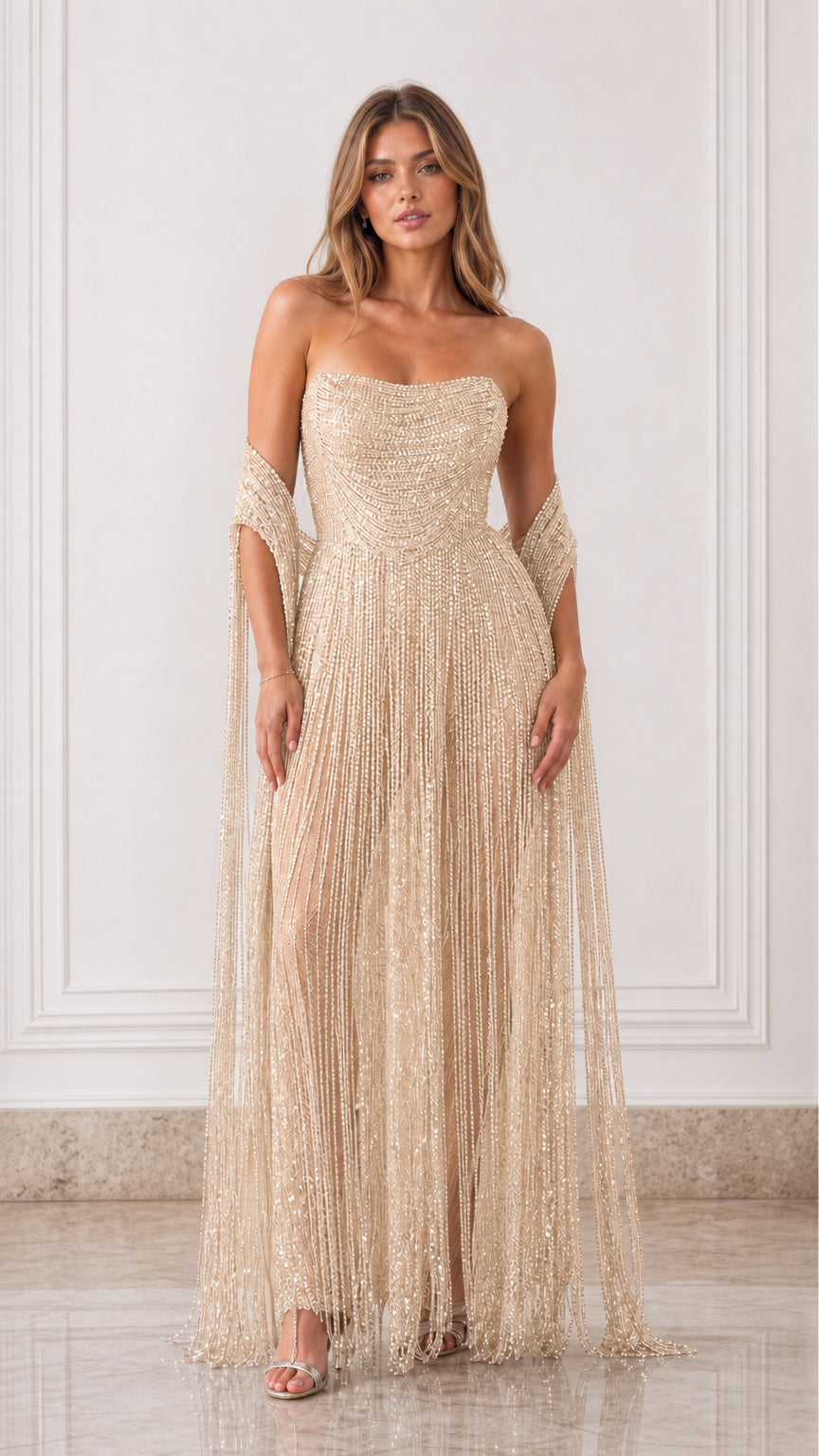 Full-length front view of champagne gold strapless beaded fringe formal gown