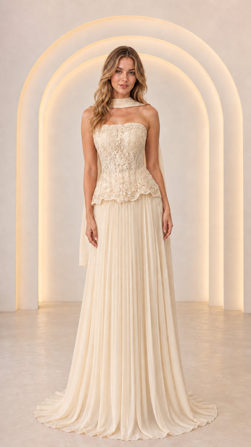 Front view of Champagne off-white strapless lace peplum evening gown with flowing pleated skirt