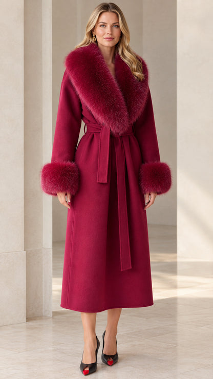 Full front view of model wearing long wine red wrap coat with plush collar and cuffs
