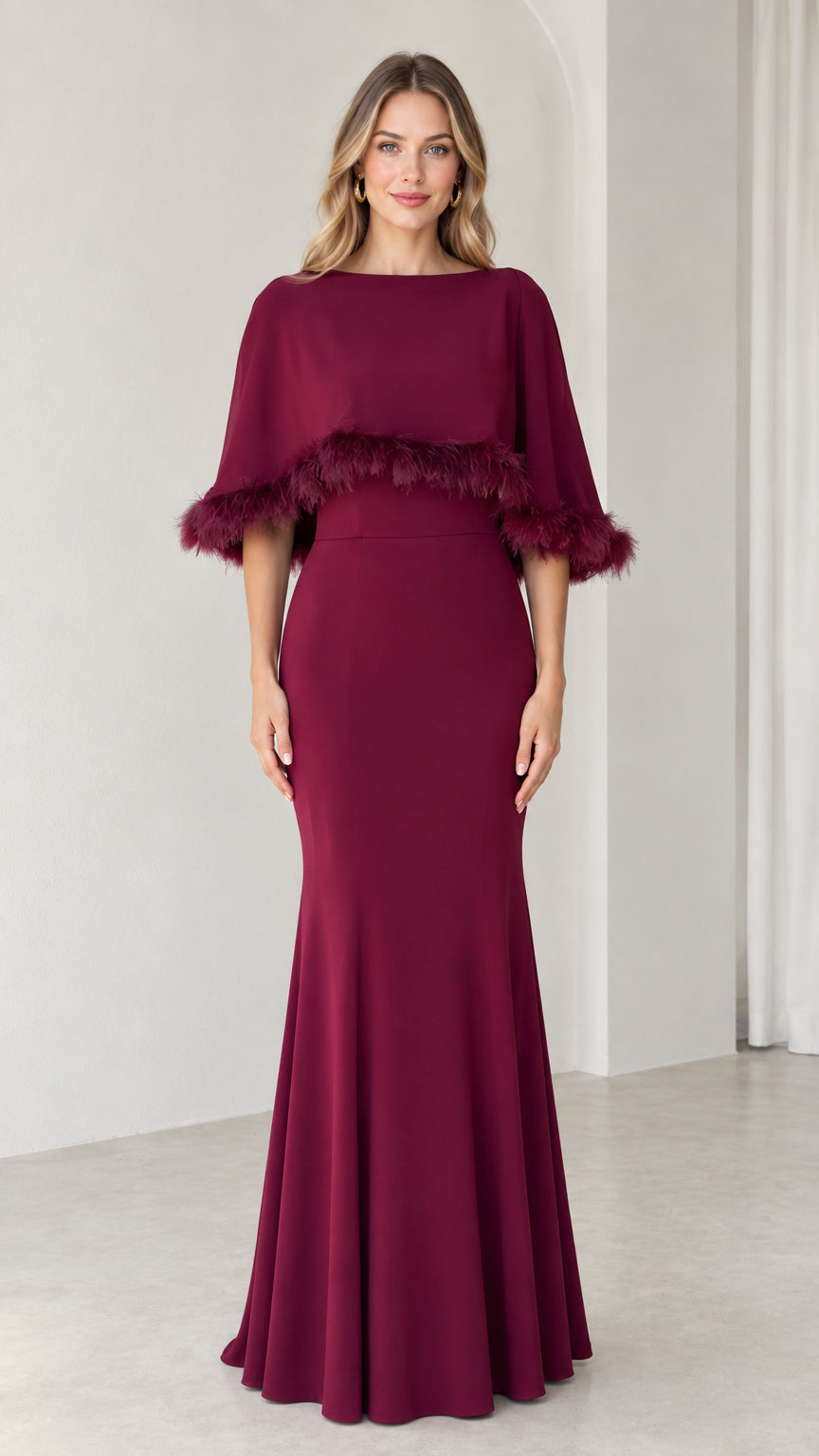 Front view of burgundy mermaid evening dress with feather trim capelet