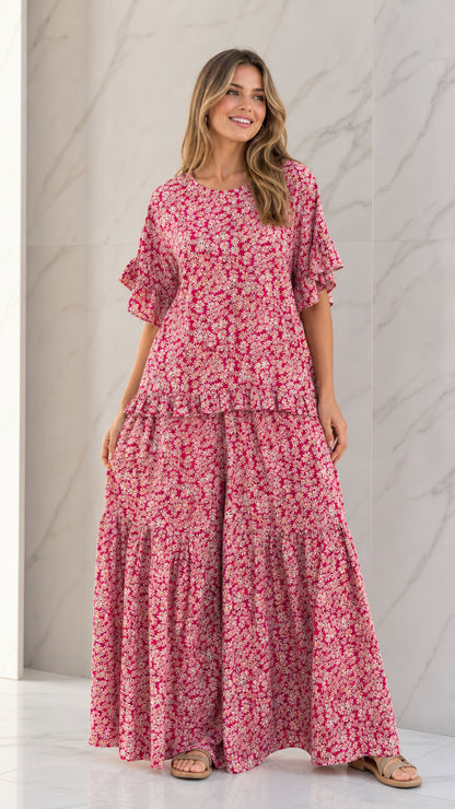 Front full view of woman wearing Rose Pink floral ruffle sleeve top and tiered wide-leg pants set