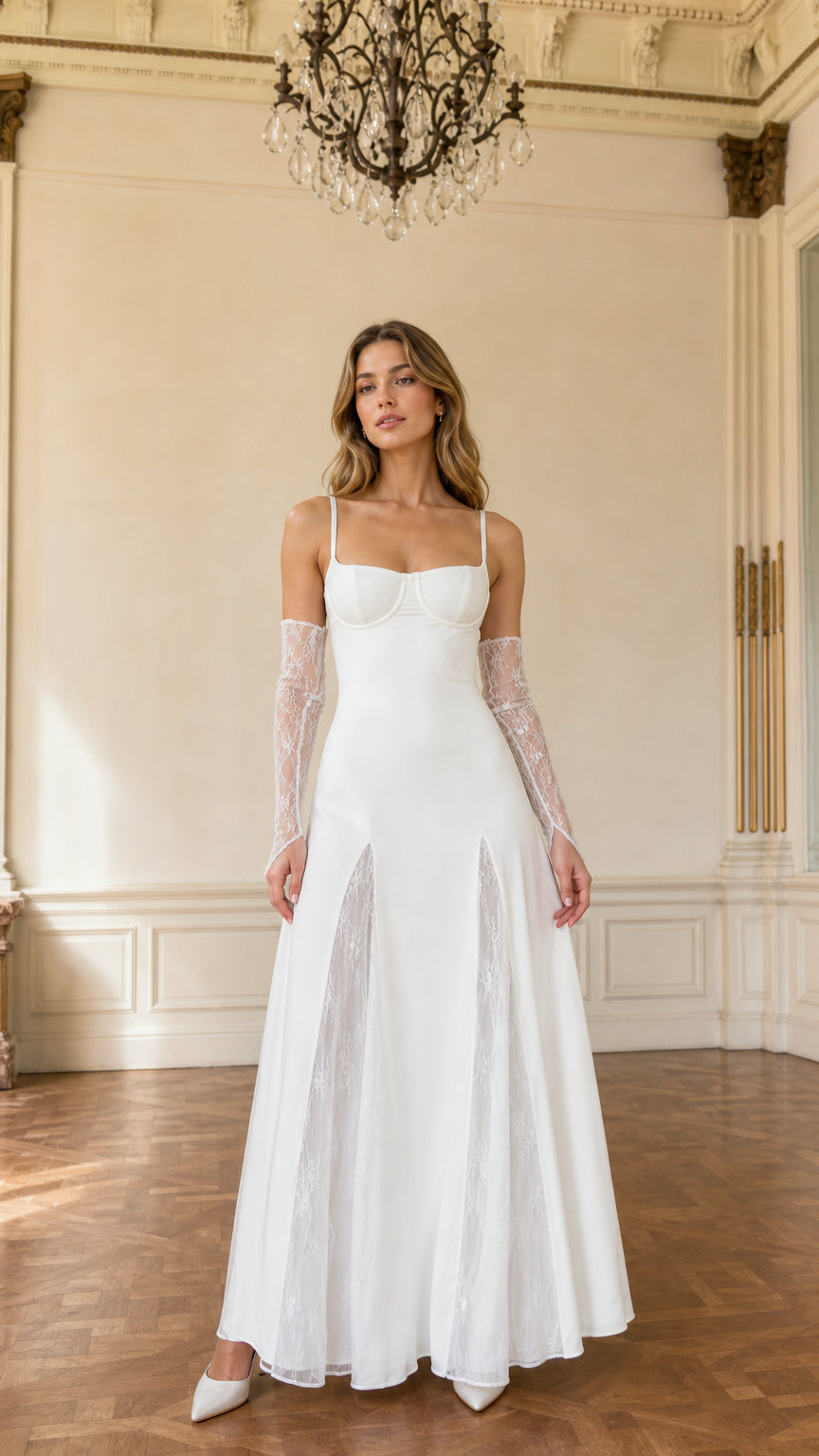 Front view of model wearing white bustier maxi gown with lace insets and lace gloves