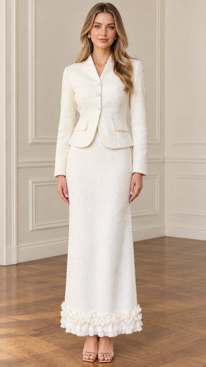 Front full-length view of woman wearing ivory tweed blazer and maxi skirt two-piece set