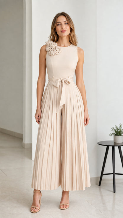 Front view of Beige pleated wide-leg jumpsuit with floral shoulder detail