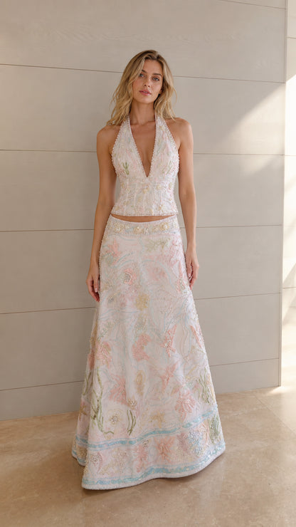 Ivory embroidered halter crop top and maxi skirt set shown from the front