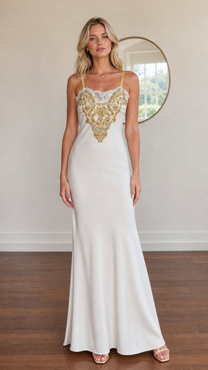 Model wearing white satin maxi dress with gold embroidered bodice front view
