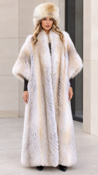 Front view of model wearing a long silver grey faux fur maxi coat and matching hat