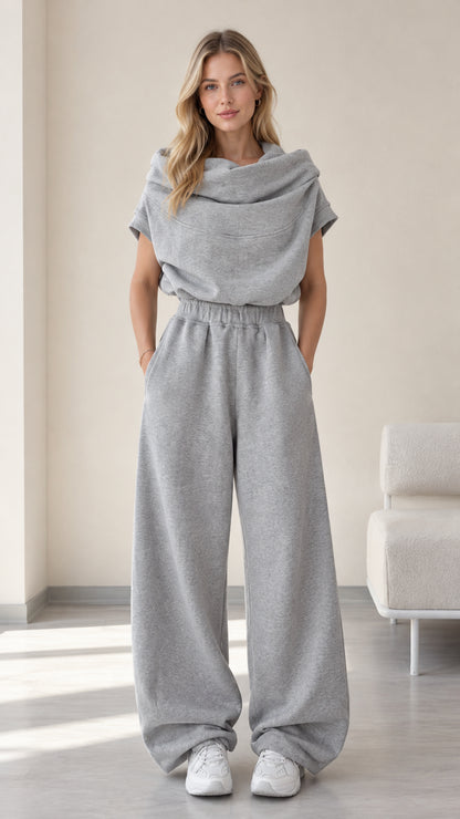 Front full-length view of model wearing heather grey cowl neck top and wide-leg sweatpants set