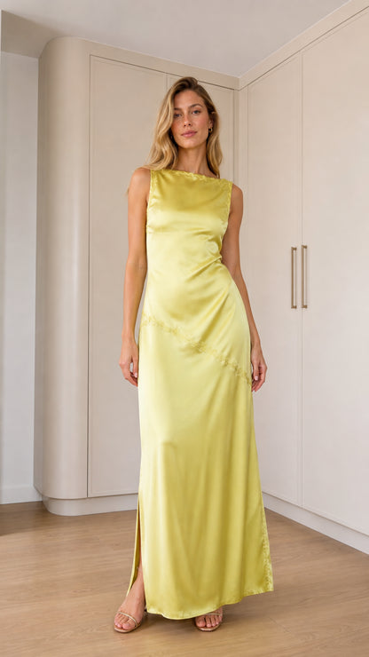 Front full-length view of model wearing pale yellow sleeveless satin maxi dress