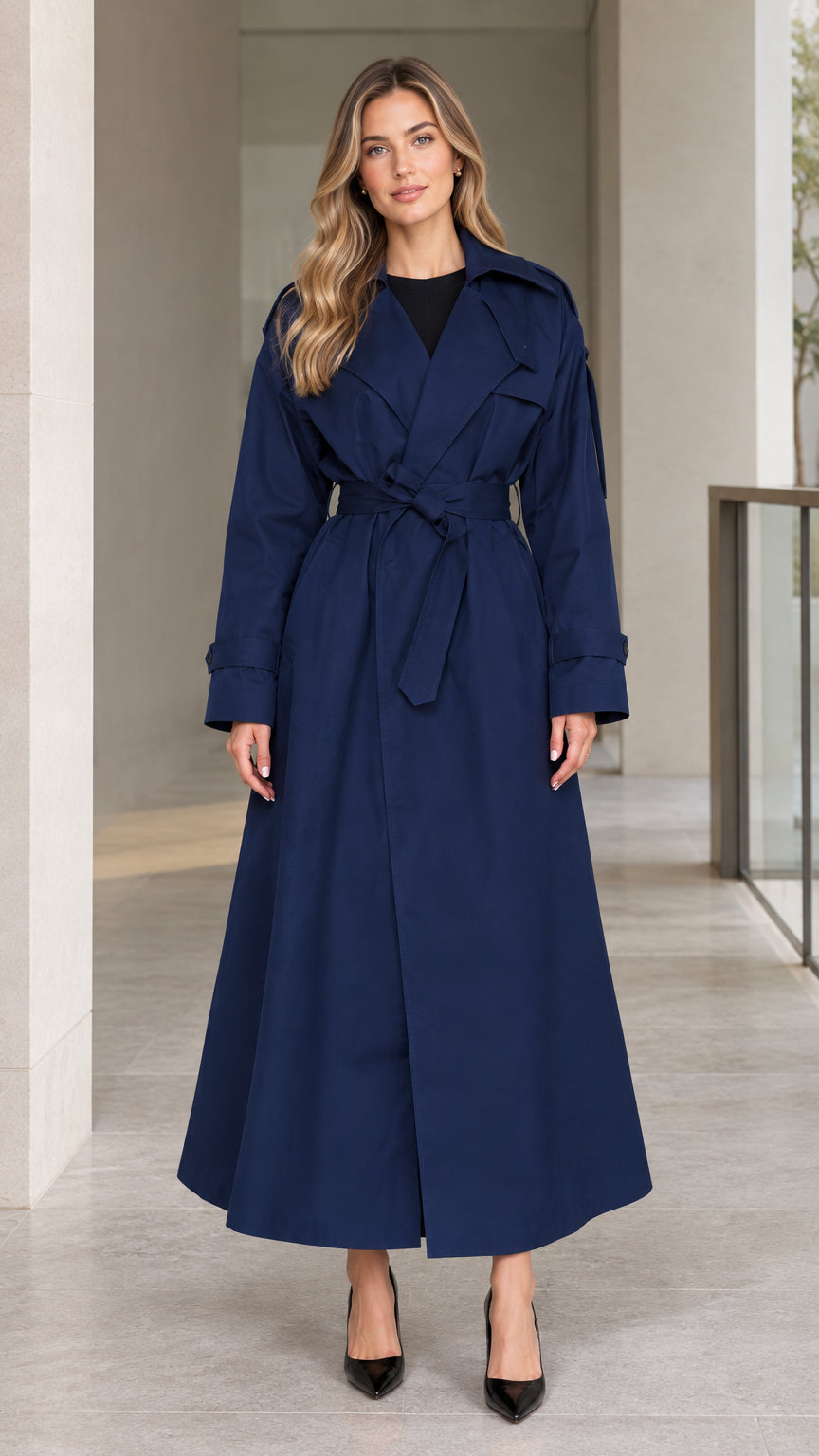 Front view of model wearing Navy Blue full-length belted maxi trench coat