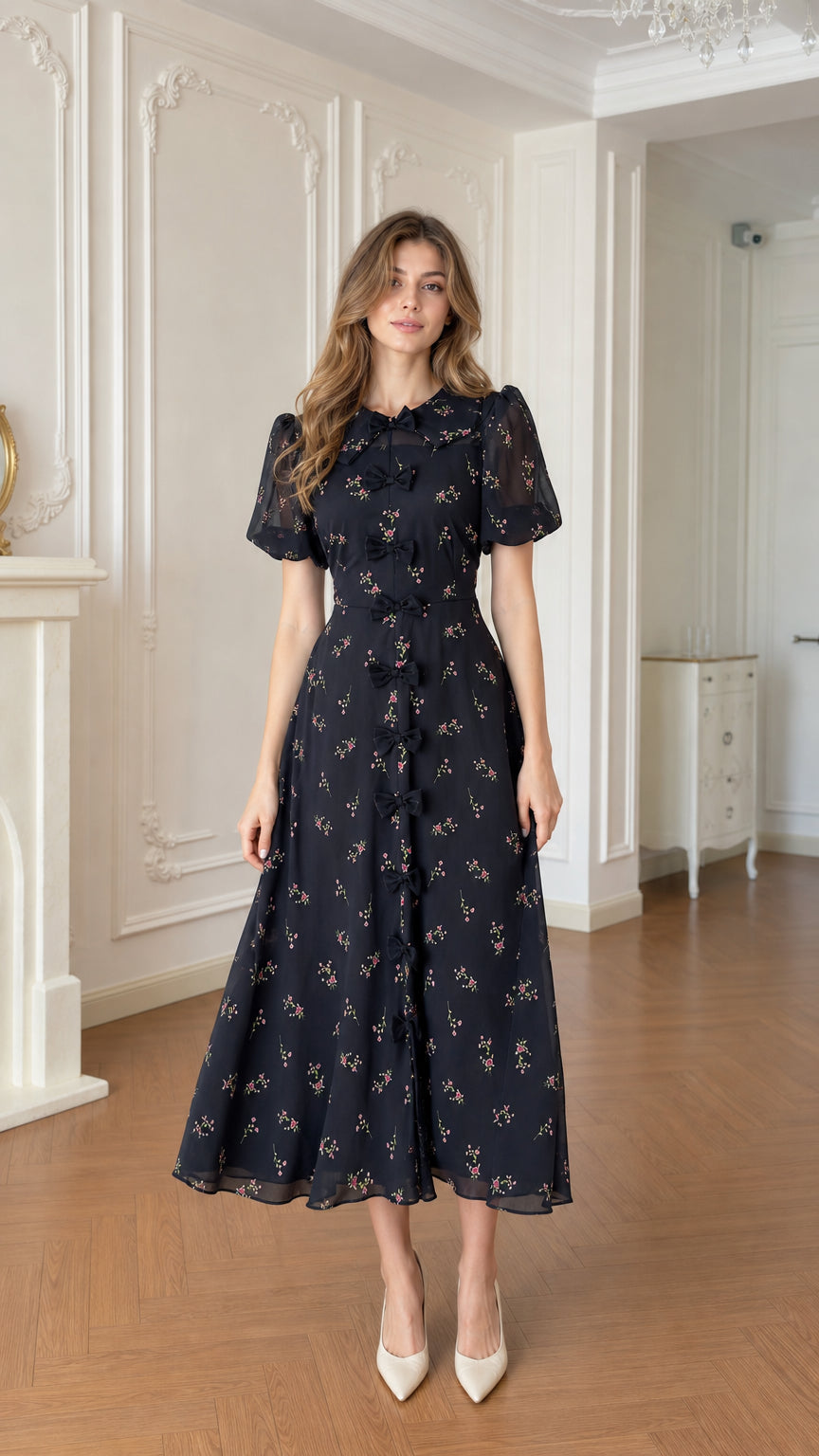 Full front view of black floral bow-front A-line midi dress with short puff sleeves