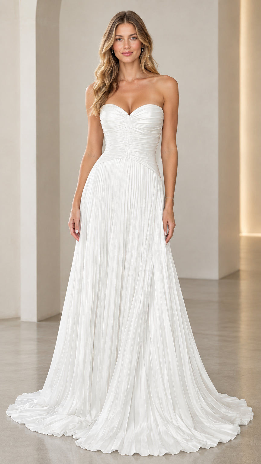 Front view of model wearing white strapless sweetheart pleated evening gown
