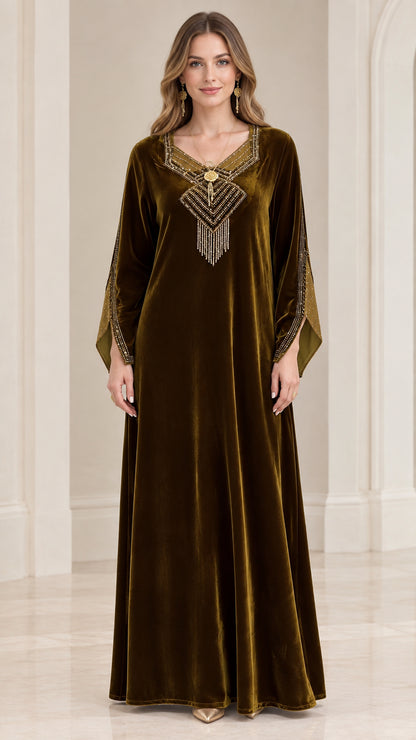 Front view of woman wearing olive green velvet kaftan maxi dress with beaded V-neck fringe