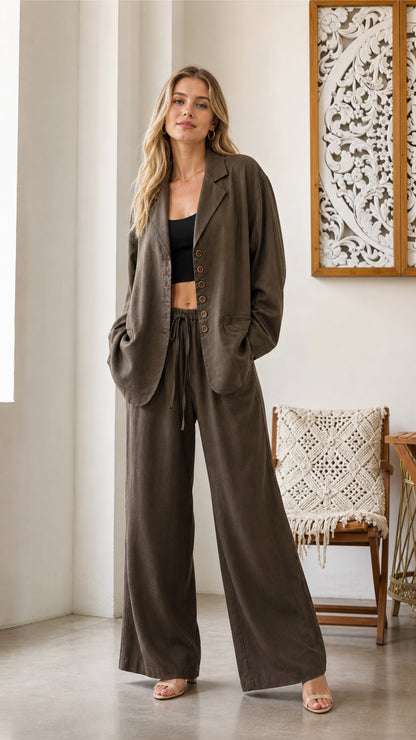 Front view of model wearing olive blazer and wide-leg pants set