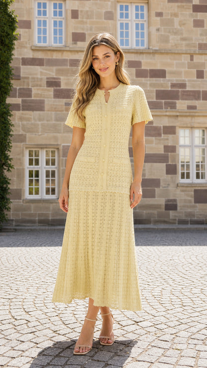 Front view of model wearing yellow textured knit midi dress