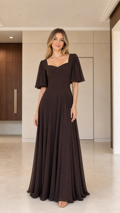 Front view of woman wearing chocolate brown sweetheart flutter sleeve maxi dress