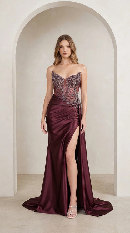 Model wearing burgundy sequin corset satin evening gown front view