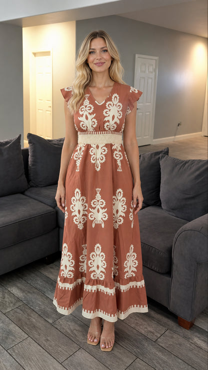 Front view of rust boho V-neck maxi dress with smocked waist