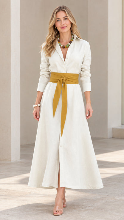 Front view of model wearing cream long sleeve maxi shirt dress with yellow sash belt
