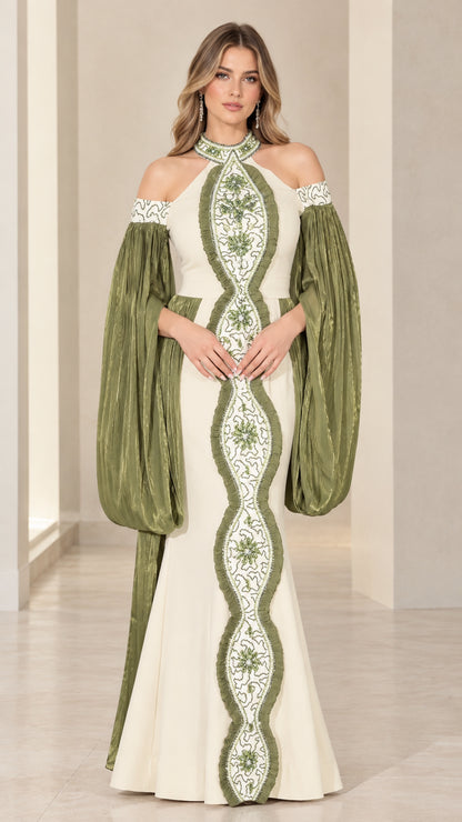 Full front view of model wearing ivory and olive halter embellished evening gown with balloon sleeves