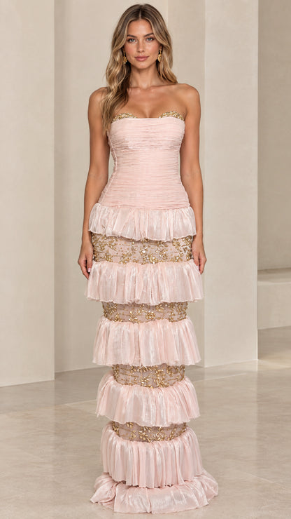 Front view of model wearing Blush Pink strapless tiered evening gown with gold embroidery