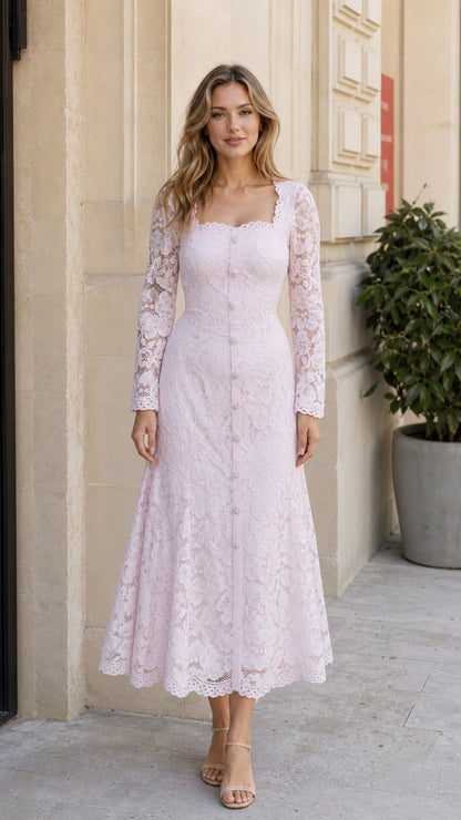 Front full-length view of a woman wearing the blush pink floral lace long sleeve midi dress with crystal buttons