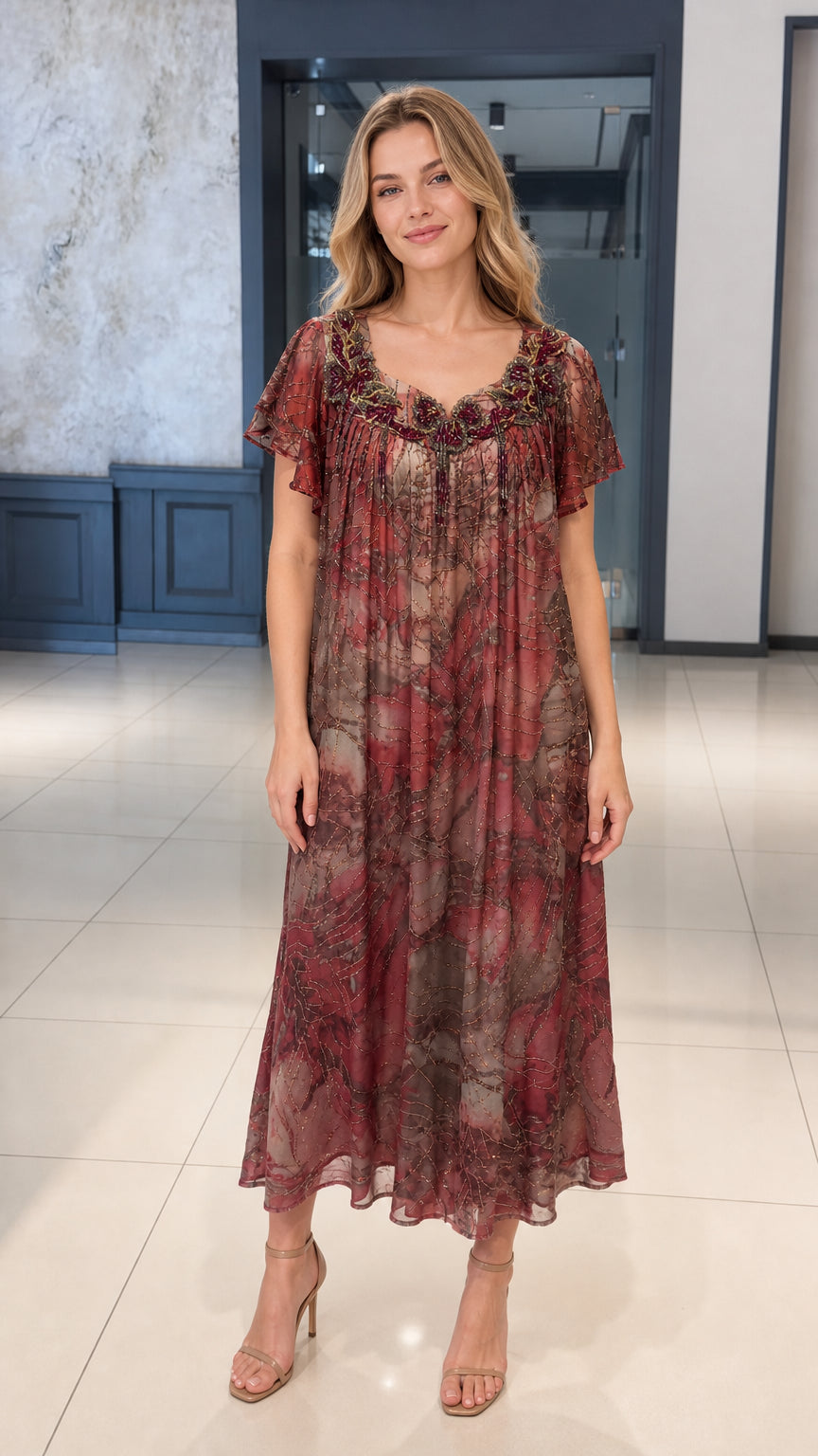 Front full view of woman wearing burgundy pleated midi dress with beaded neckline