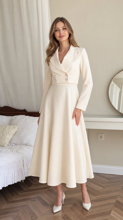 Front full-length view of model wearing cream double-breasted blazer midi dress