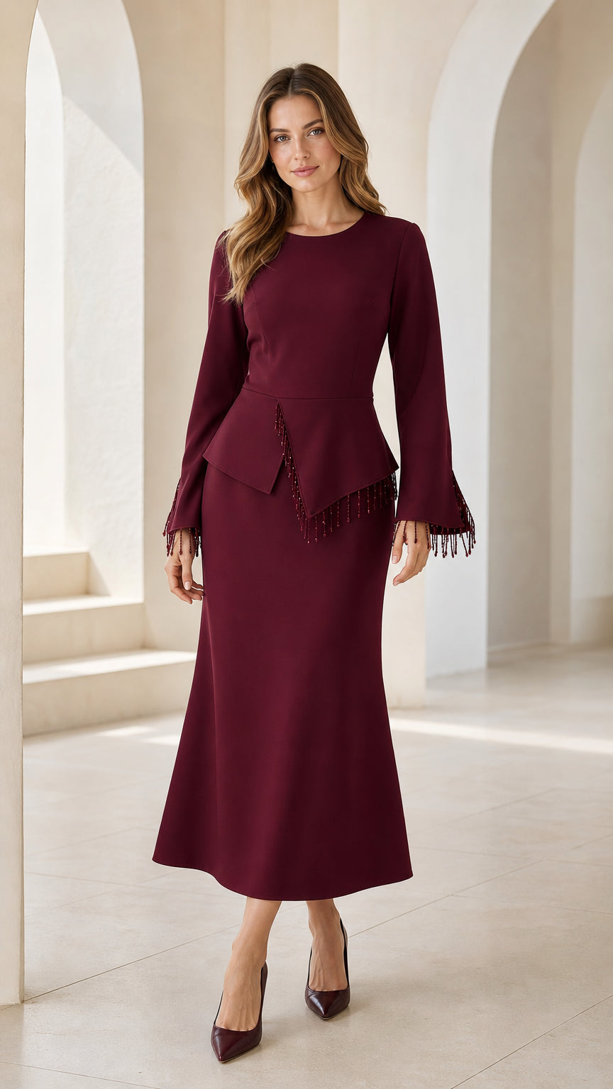 Burgundy long sleeve peplum midi dress with beaded fringe trim front view