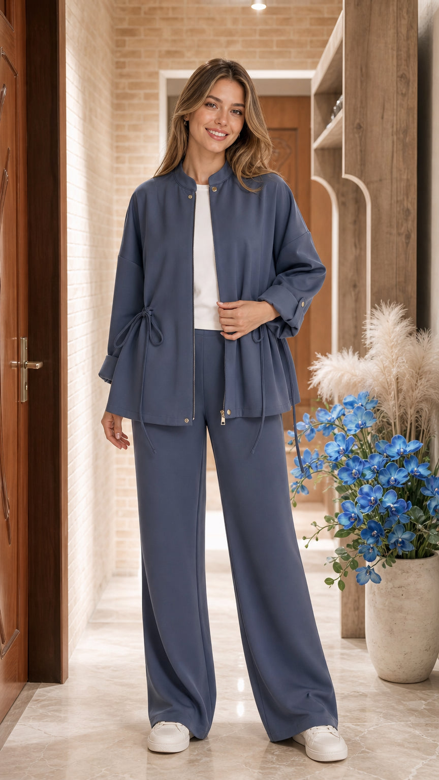 Full front view of model wearing Slate Blue zip-up jacket and wide-leg pants set
