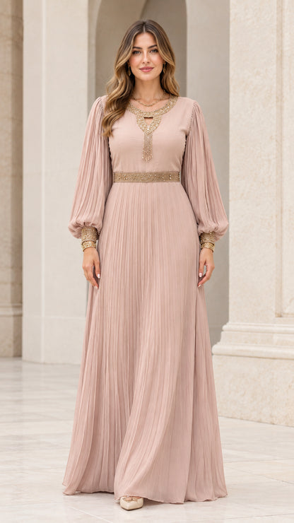 Full front view of model wearing dusty rose pleated long sleeve maxi dress with gold embroidery