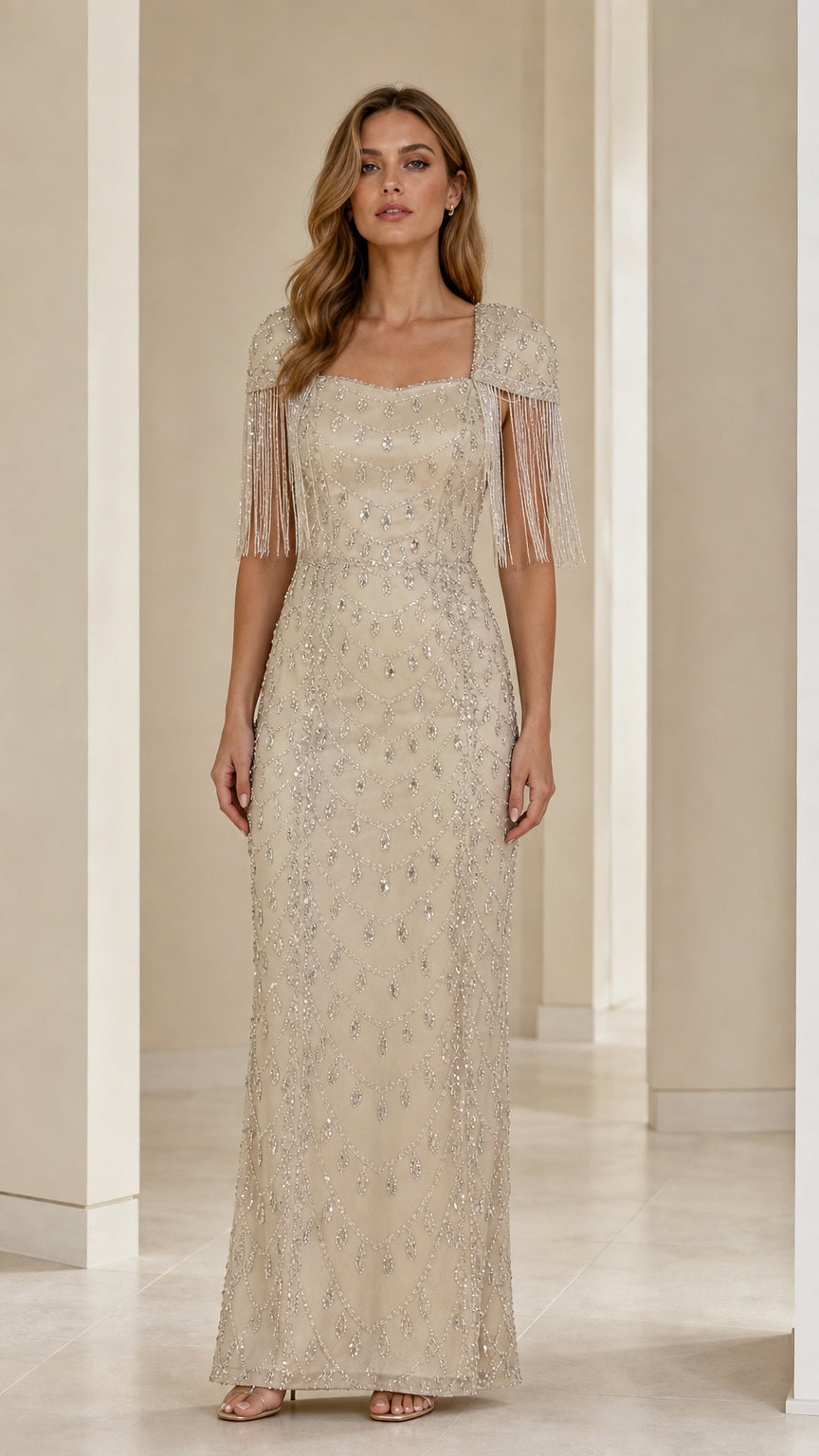 Front view of champagne beaded square neck maxi evening gown with fringe cap sleeves
