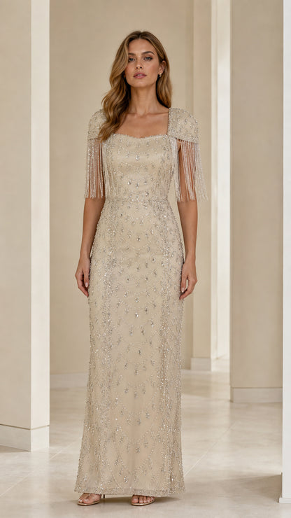 Front view of champagne beaded square neck maxi evening gown with fringe cap sleeves