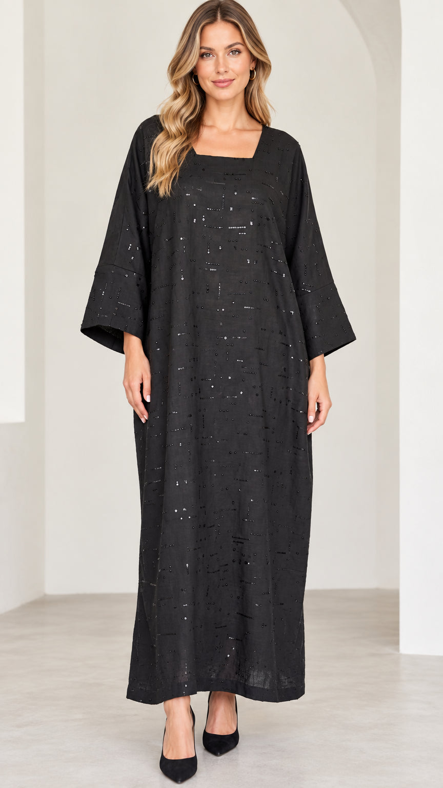 Front view of model wearing black square neck sequin embellished kaftan maxi dress