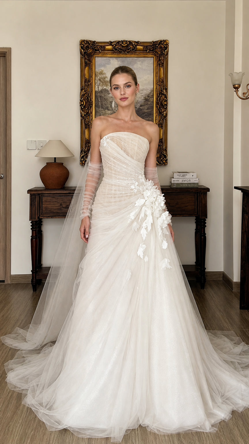 Front view of white strapless tulle wedding gown with 3D floral appliques
