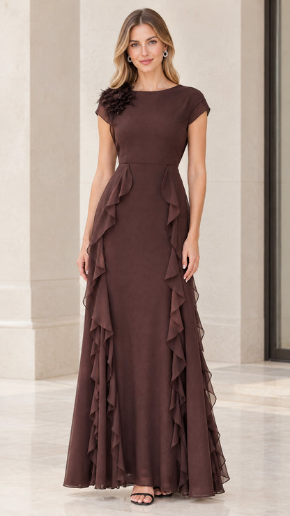 Front view of woman wearing chocolate brown floral appliqué ruffle evening gown